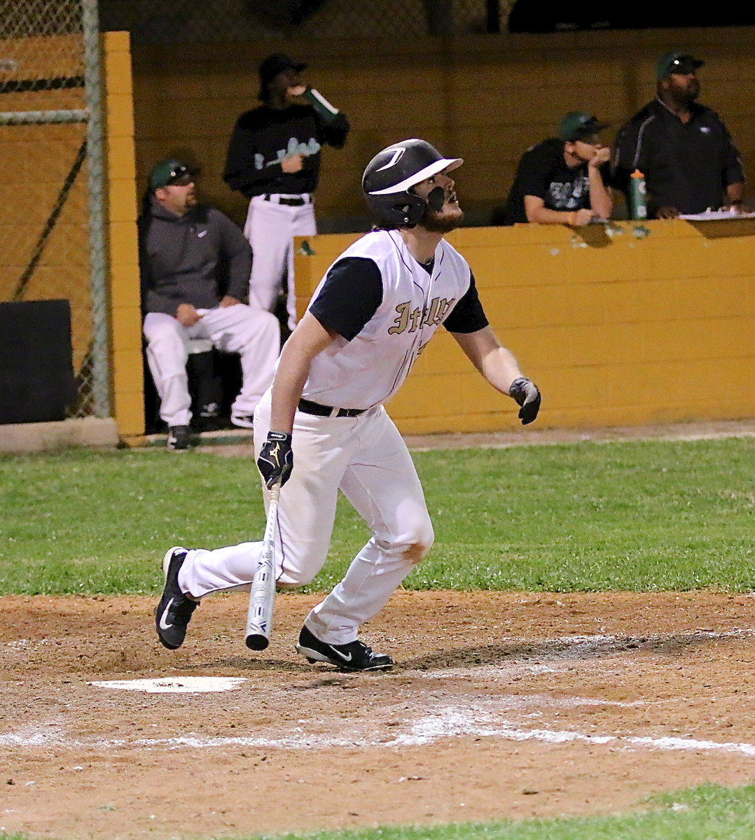 Image: Gladiator junior Kyle Fortenberry(14) smacks one high into centerfield.