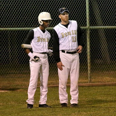 Image: Eric Carson(2) and Italy Baseball head coach Jon Cady(11) discuss their options to get on base.
