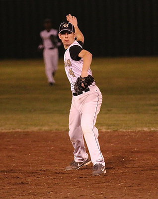 Image: Second-baseman Ryan Connor(4) fields a ground ball and then throws to first base for the out.