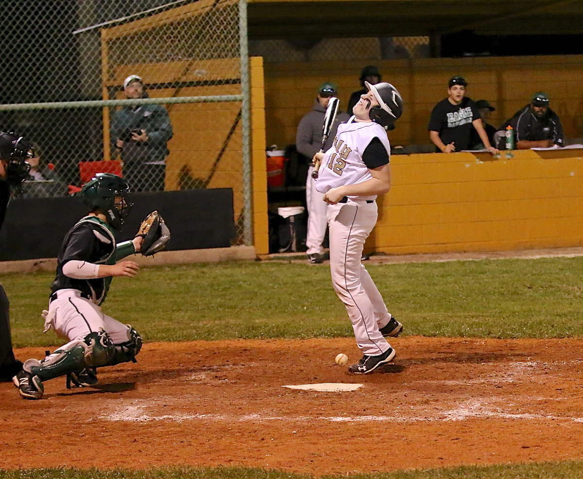 Image: John Escamilla(12) absorbs a pitch to the elbow with the game on the line.