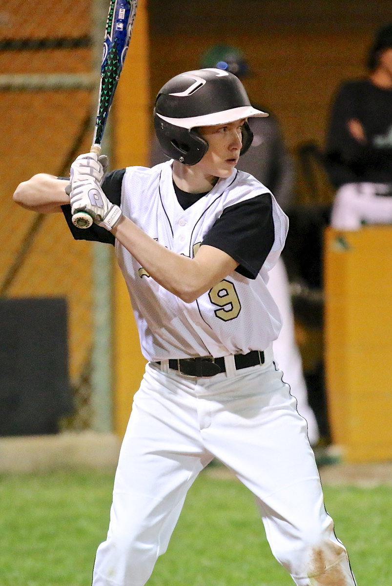 Image: Clayton Miller(9) is determined as he glares toward the mound at the Eagle pitcher.