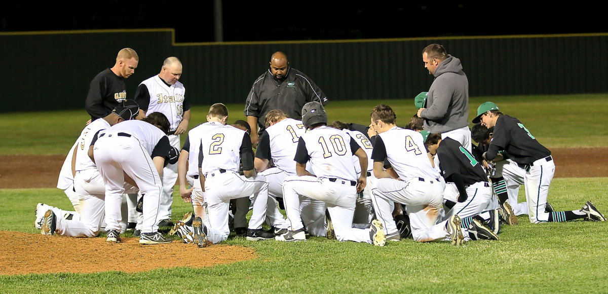 Image: Both teams unite in a post game prayer.