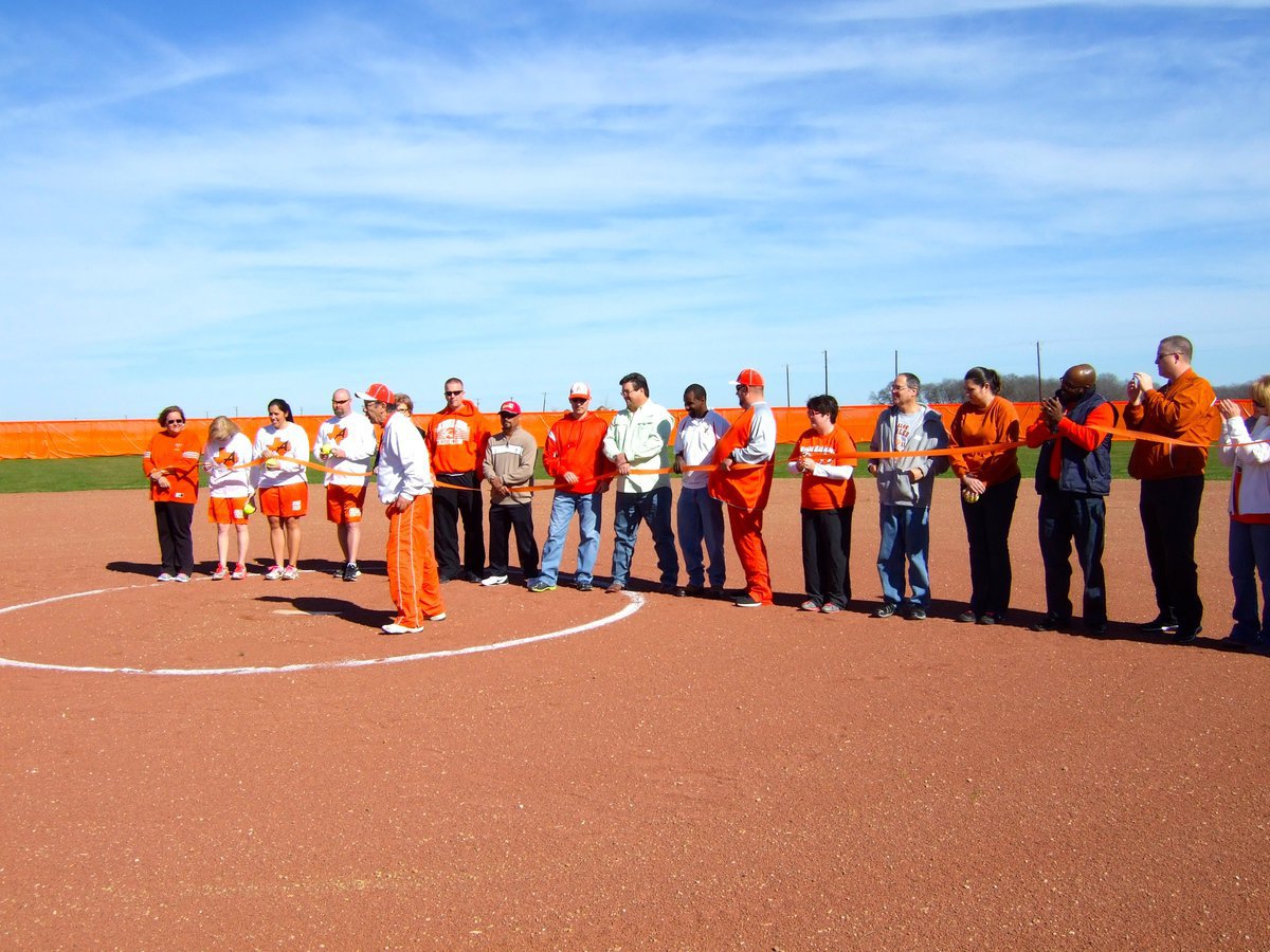 Image: Dr. Del Bosque is getting ready to cut the ribbon on Avalon ISD’s first ever softball field.