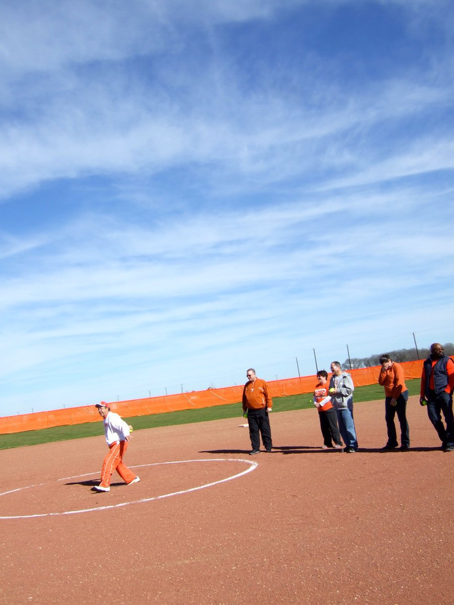 Image: Dr. Del Bosque throws the first pitch.