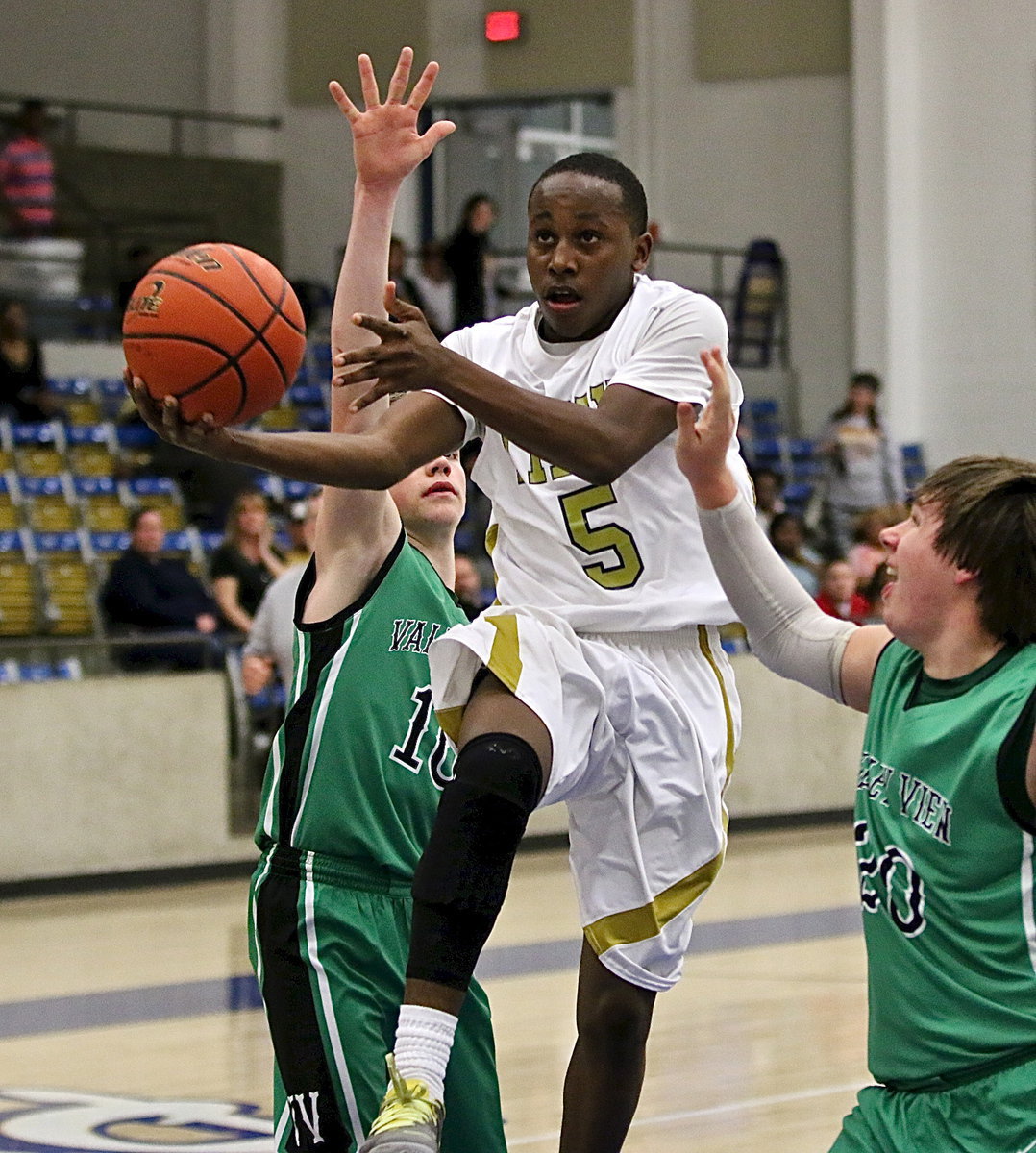 Image: Freshman guard Kevin Johnson(5) was the man of the hour for the Gladiators Tuesday night in Saginaw. Johnson scored 17-points, thirteen in the fourth alone, to propel Italy past Valley View for the Class A bi-district championship.