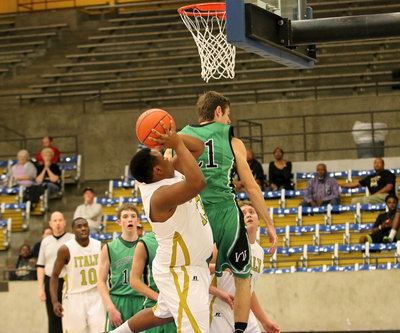 Image: Gladiator Darol Mayberry(13) grabs a rebound and then double clutches to score the put back and-1.