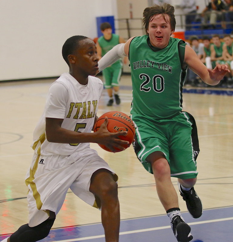 Image: Kevin Johnson(5) drives to the hoop with little concern for the Eagle defense.