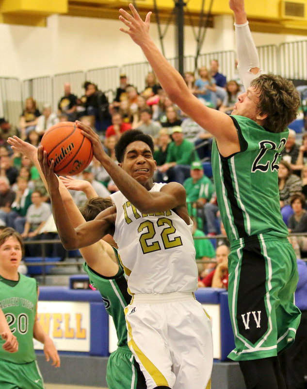 Image: Trevon Robertson(22) tries to draw a shooting foul for Italy late in the game.