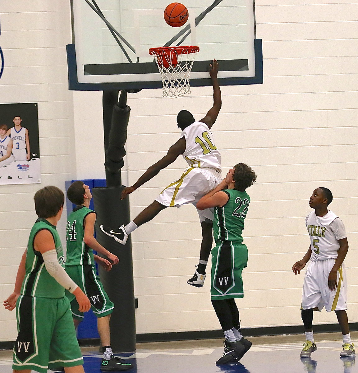 Image: Gladiator TaMarcus Sheppard(10) gets up in the air in an attempt to challenge an Eagle shooter.