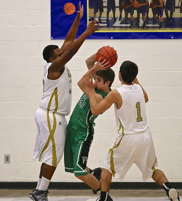 Image: Gladiators Darol Mayberry(13) and Mason Womack(1) smother an Eagle ball handler.