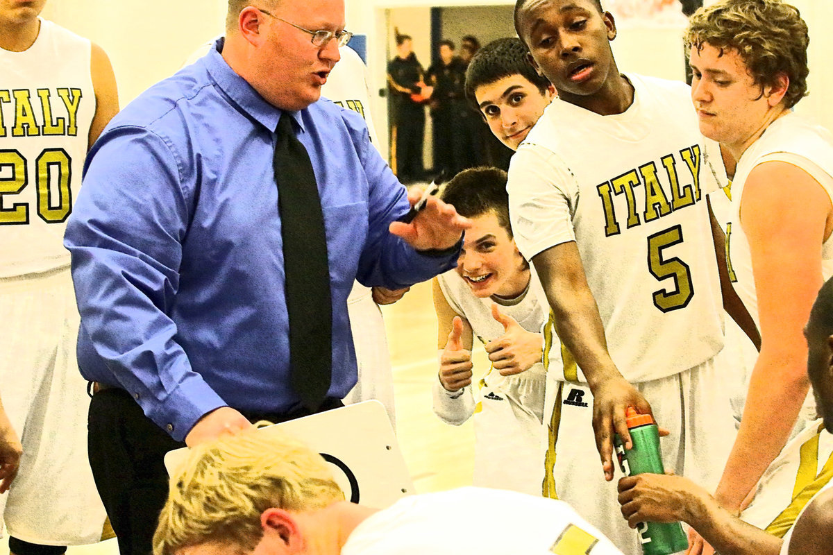 Image: Ty Windham(12) and Mason Womack(1) feel pretty good about Italy’s chances of winning as head coach Brandon Ganske gets serious during a timeout late in the game.