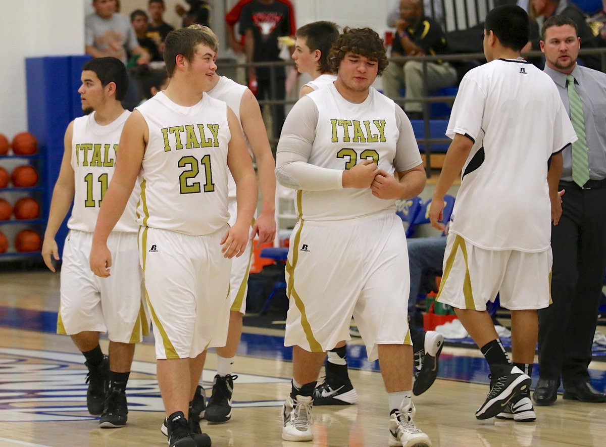 Image: Seniors Tyler Anderson(11), Zain Byers(21) and Kevin Roldan(33) are happy their team got the bi-district win, 54-47 over Valley View.