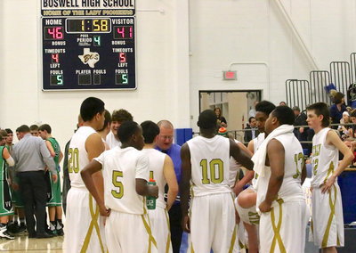 Image: Gladiator head coach Brandon Ganske strategizes with his troops during  a timeout before going into crunch time.