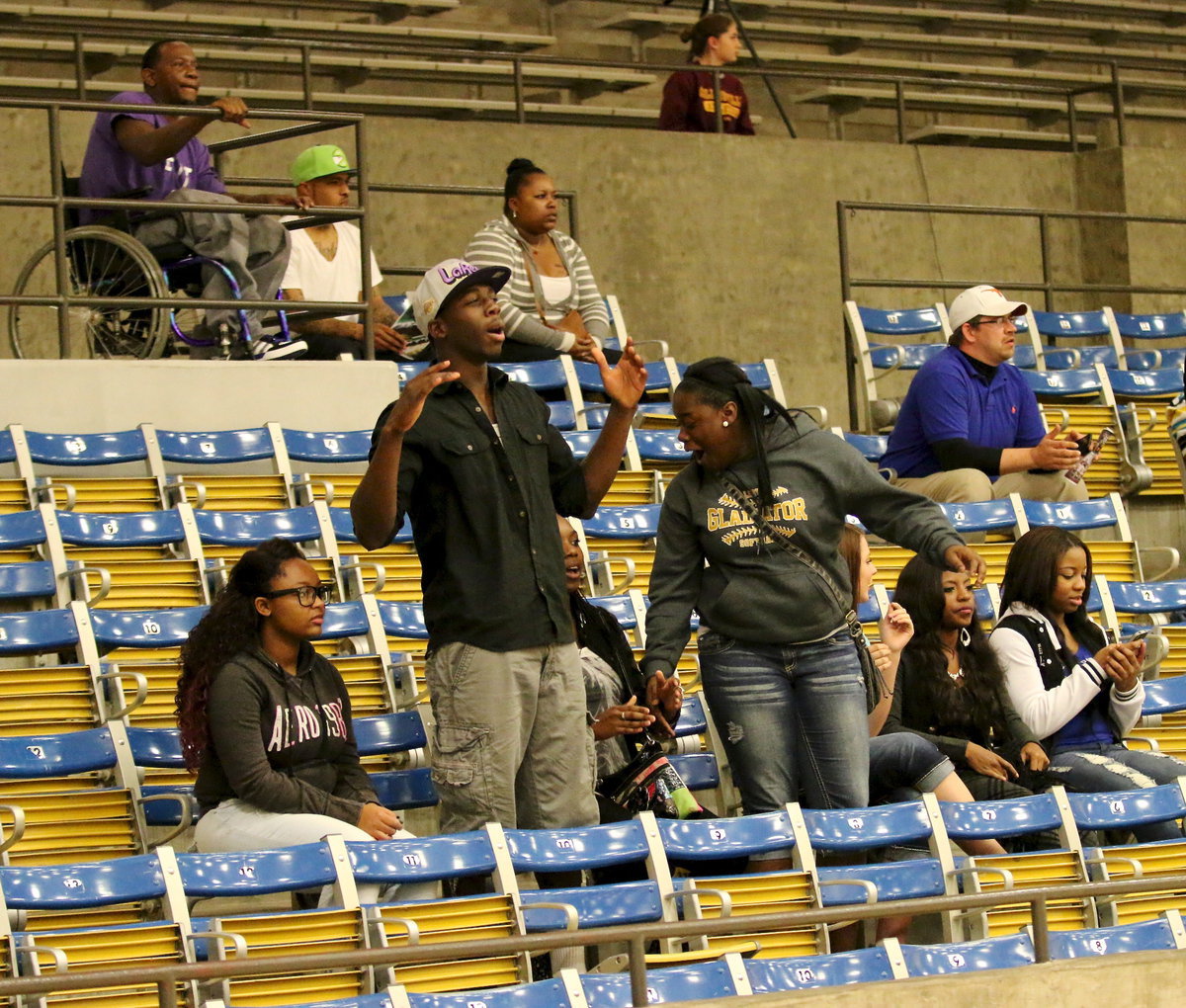 Image: JV Gladiator Kumbo Bailey and Lady Gladiator Taleyia Wilson lead the cheers for the Gladiators.