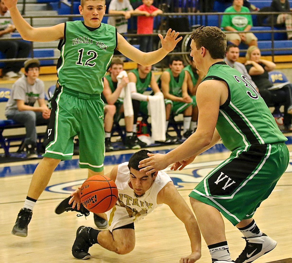 Image: Ouch! Tyler Anderson(11) takes a tumble after being tripped up by the Eagles.