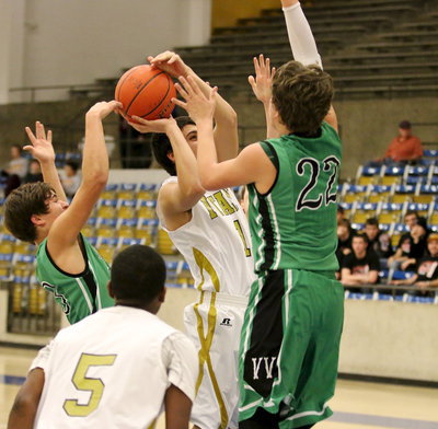 Image: An aggressive move by Mason Womack(1) earns him a trip to the foul line.