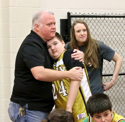 Image: As one of his final tasks as the Stafford Elementary principal, Jonathan Nash was on hand to show his support for Italy’s team members. Here, Nash and CBI teacher Angela Chambers comfort Wyatt Ballard(24) before Ballard’s name is called to compete.