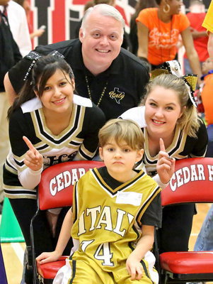 Image: Principal Jonathan Nash and cheerleaders Jessica Garcia and Taylor Turner encourage Frank South(14) as he prepares to compete.