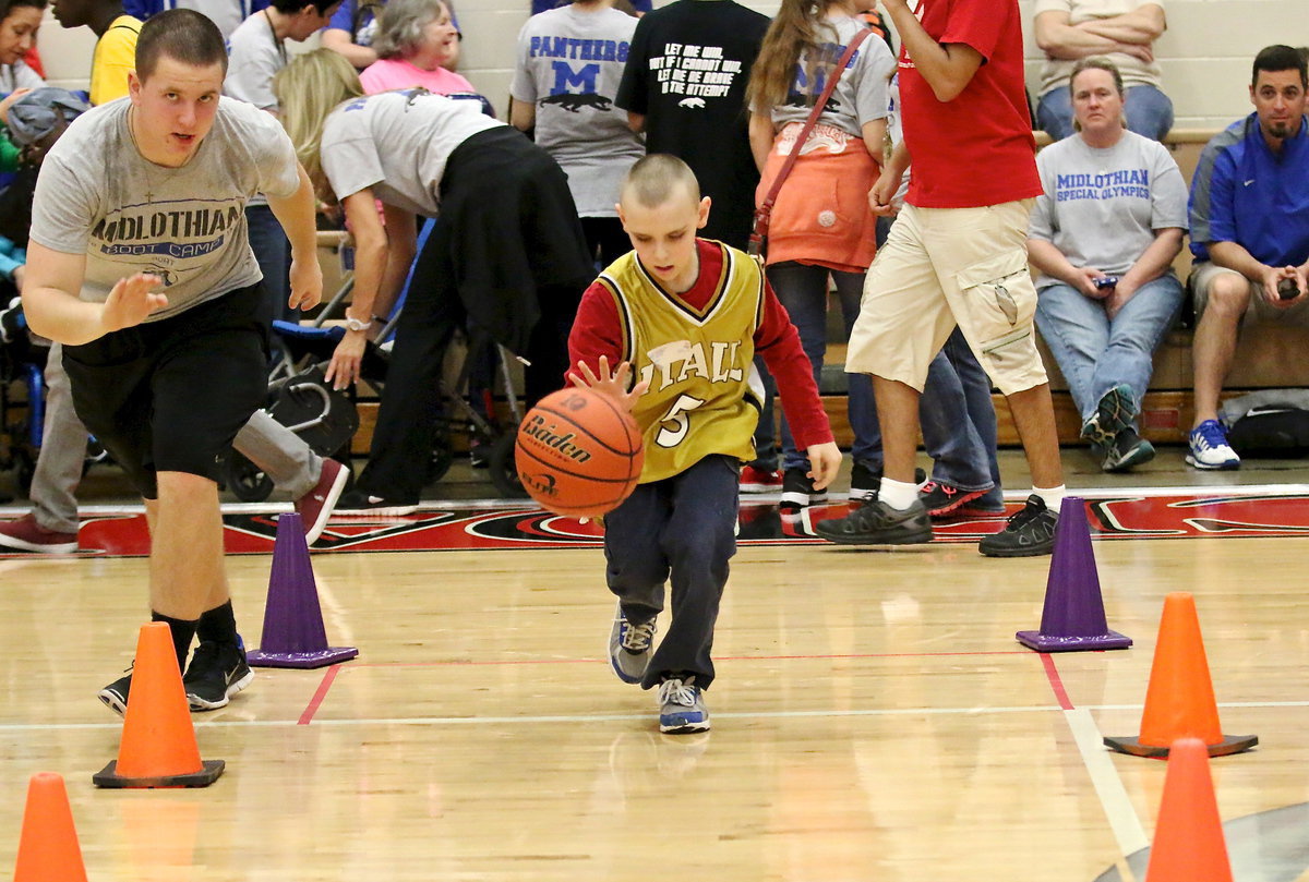 Image: Charlie Bolin(5) recorded one of the fastest times of the day during the timed speed dribbling drill where Charlie was required to dribble down and back while staying between the cones.