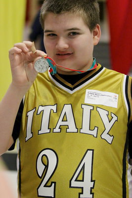 Image: Overcoming an injured finger on his shooting hand, Wyatt Ballard(24) proudly displays his 2nd place medal for the Italy Neotribune readers.