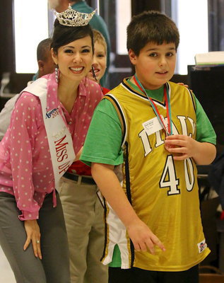 Image: Wednesday was one of those great days! Mikey South(40) was presented his 3rd place medal from Coppell’s Kelsey Conrad, Miss DFW 2014, who added beauty and bling to the medal ceremonies for the areas’ special olympians.