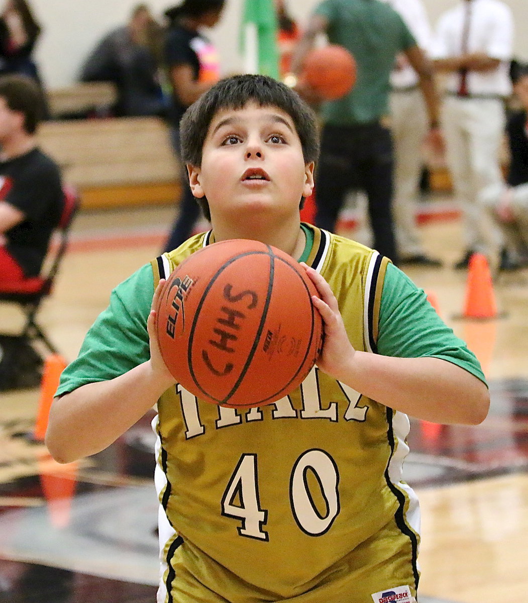 Image: Mikey South(40) puts up a jumper during the long shot event.