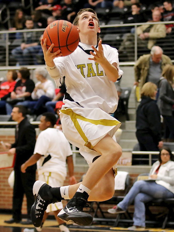 Image: Sophomore Gladiator Ty Windham(12) shows his skills during warmups.