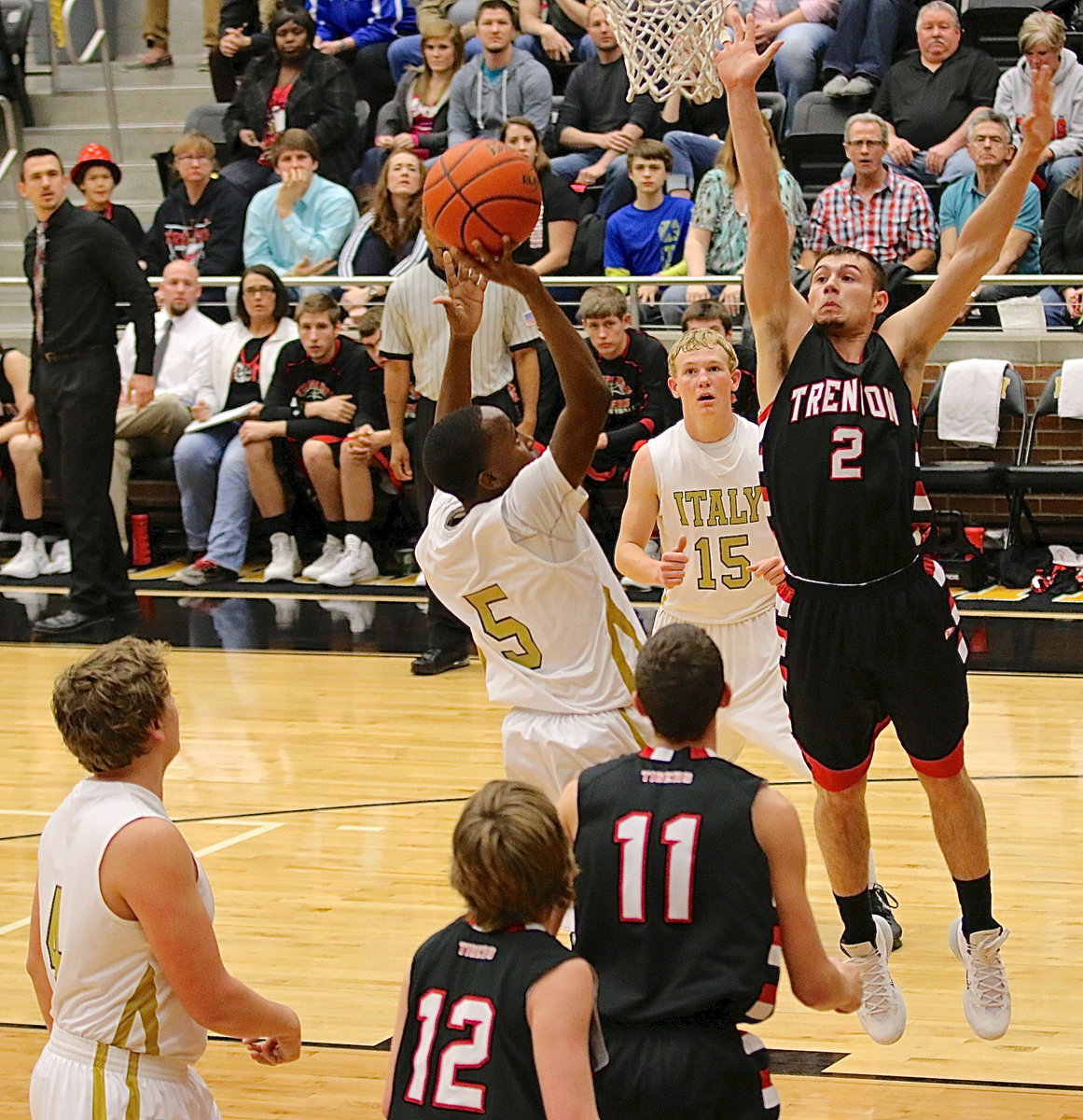 Image: Freshman guard Kevin Johnson(5) penetrates into the lane to score over an outstretched Tiger paw.