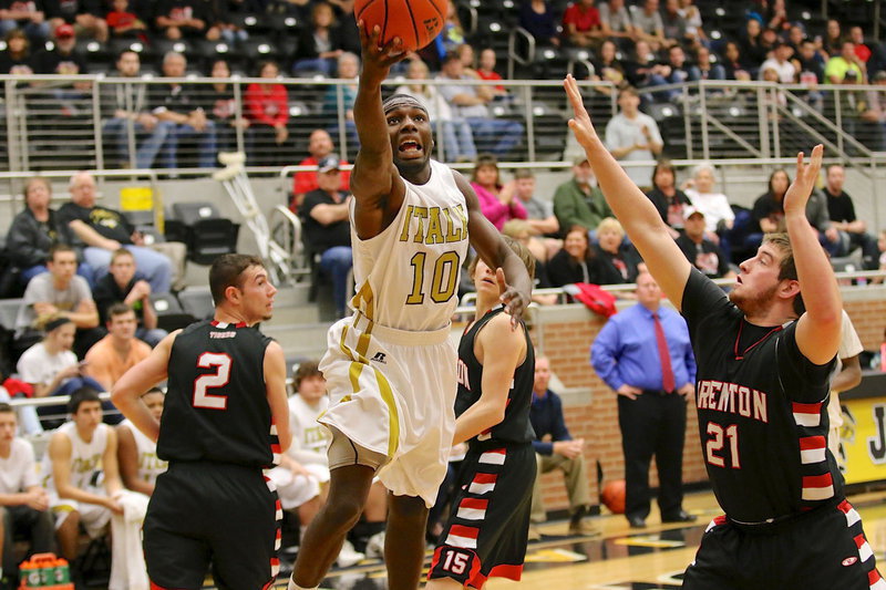 Image: TaMarcus Sheppard(10) slices thru the Tiger defense to put up a layup.