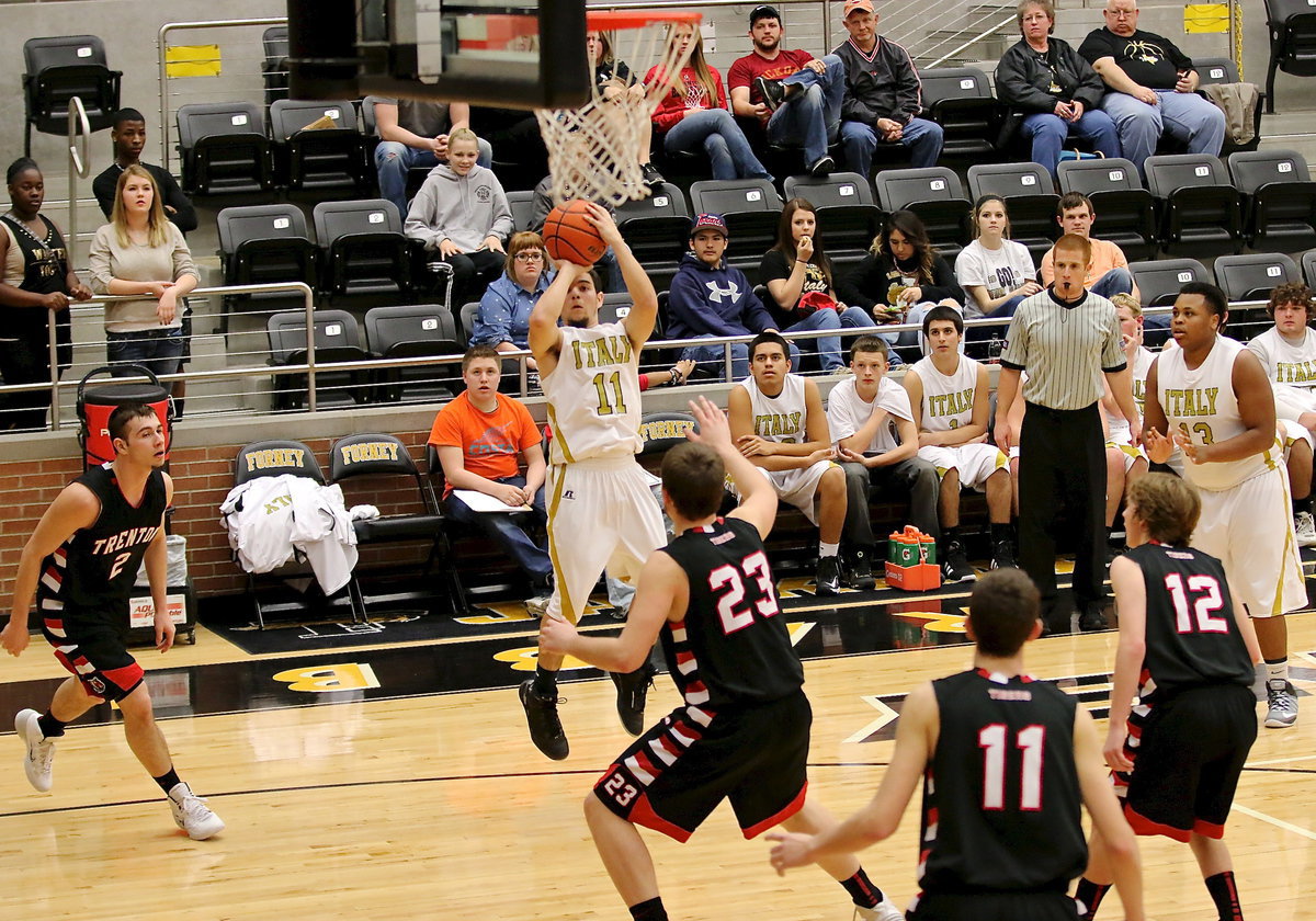 Image: Tyler Anderson(11) eludes a defender and then takes the open jumpshot over Trenton’s defense.