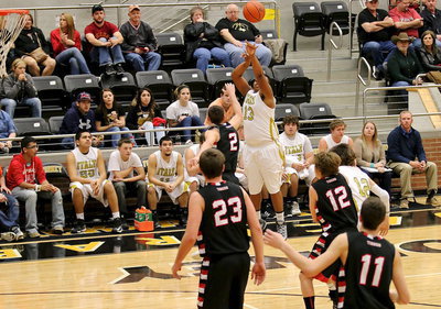Image: Darol Mayberry(13) puts in one of his two 3-pointers against Trenton.
