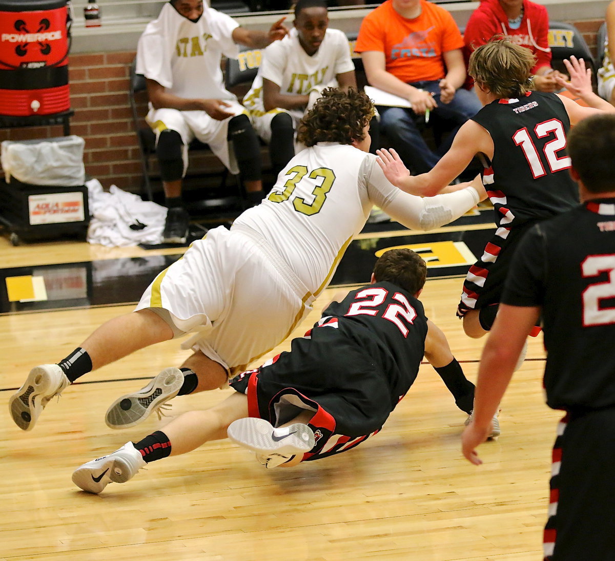 Image: Kevin Roldan(33) wins the fight for the ball and passes to a teammate.