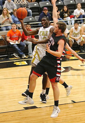 Image: Senior Gladiator TaMarcus Sheppard(10) absorbs a foul at the end of an Italy fast break.