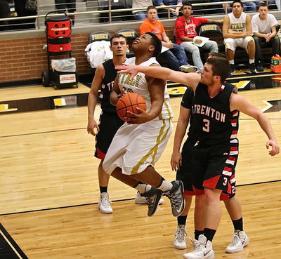 Image: Darol Mayberry(13) gets fouled on the way back up but is not awarded any free-throws.