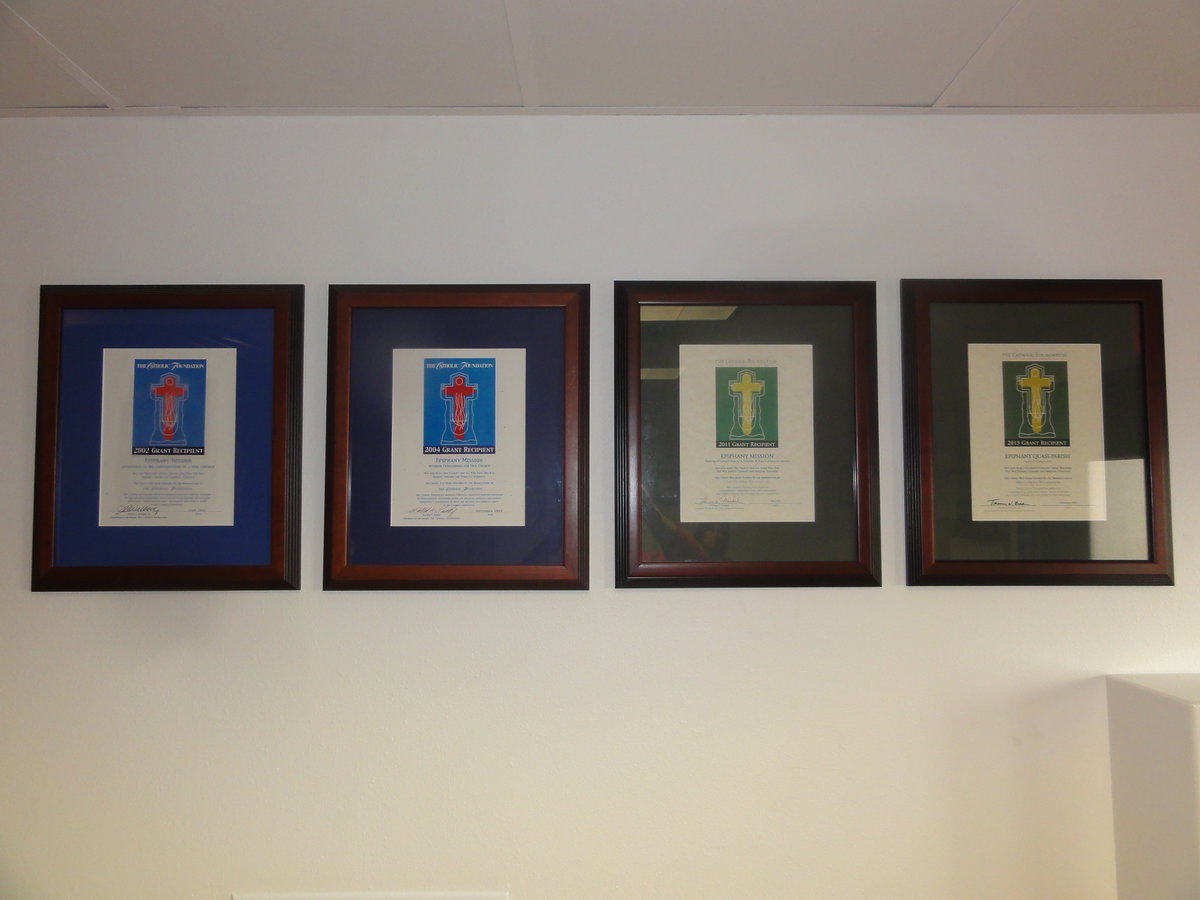 Image: These are the grant award plaques from The Catholic Foundation.  They are from left to right 2002, 2004, 2011, 2013 as mentioned in the article.