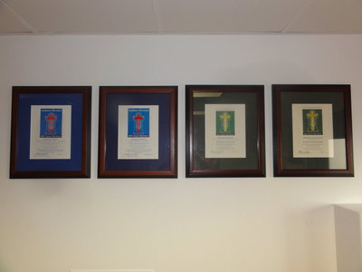 Image: These are the grant award plaques from The Catholic Foundation.  They are from left to right 2002, 2004, 2011, 2013 as mentioned in the article.