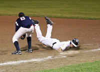 Image: JV Gladiator Mason Womack(1) beats the throw back to the first base bag but Italy falls to Red Oak Life 16-7.