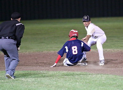 Image: Shortstop Jorge Galvan(2) gets the out at second base on a throw down for Italy’s JV.
