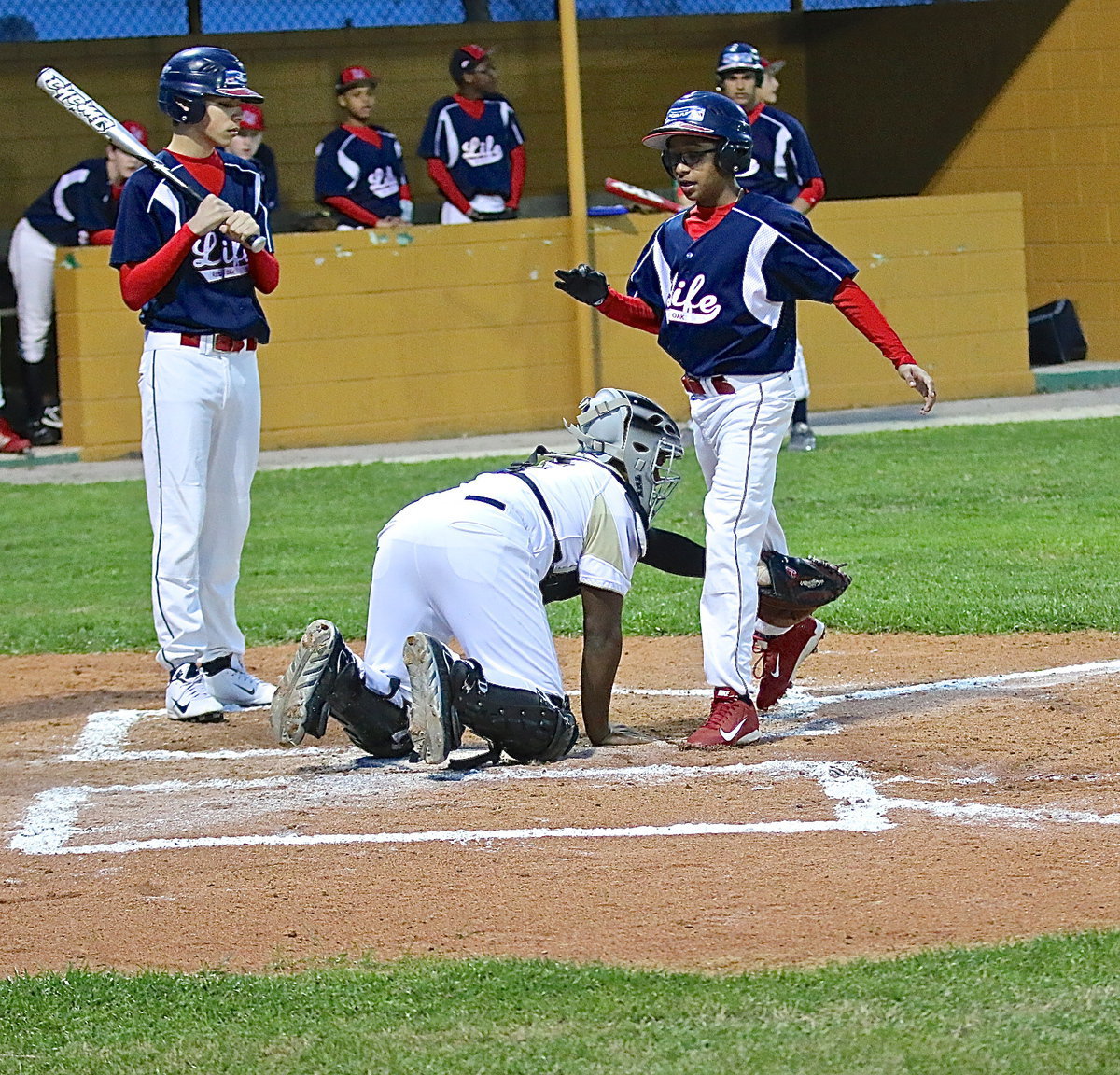 Image: Kenneth Norwood, Jr.(5) tags a Mustang runner out who was trying to be sneaky.