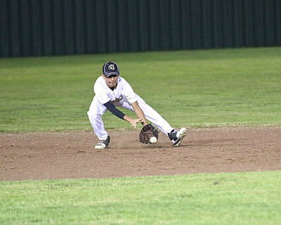 Image: Shortstop Jorge Galvan(8) fields a grounder and then throws the runner out at first base.
