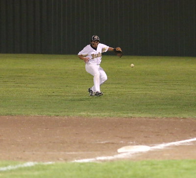 Image: JV Gladiator Jorge Rodriguez(7) responds to a blooper hit into right field.