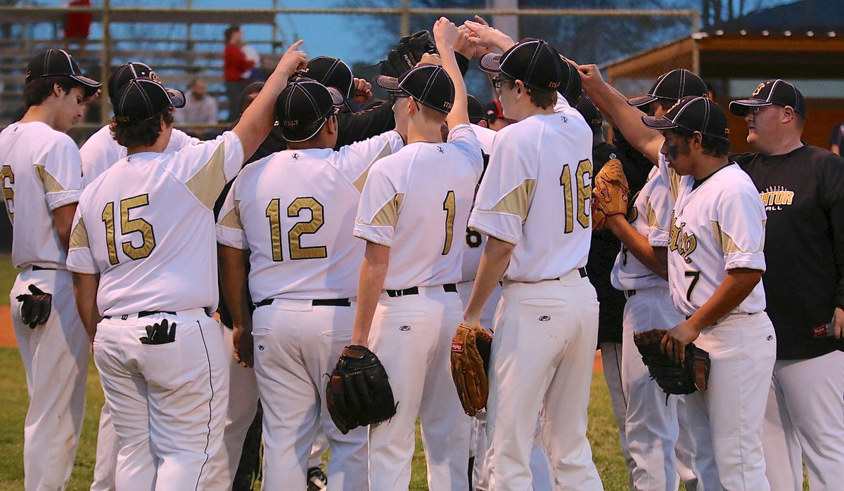 Image: The JV Gladiators break the huddle up before retaking the field.