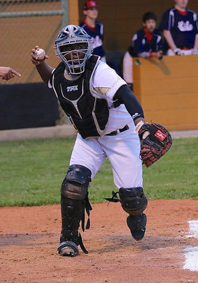 Image: Kenneth Norwood, Jr.(5), threatens to throw down to fist base which scares the runner into staying on base.
