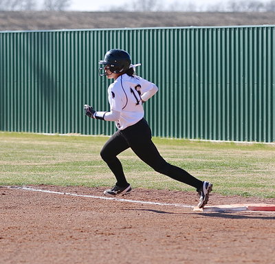 Image: Also a threat on the bases, the speedy April Lusk(16) goes after second-base.