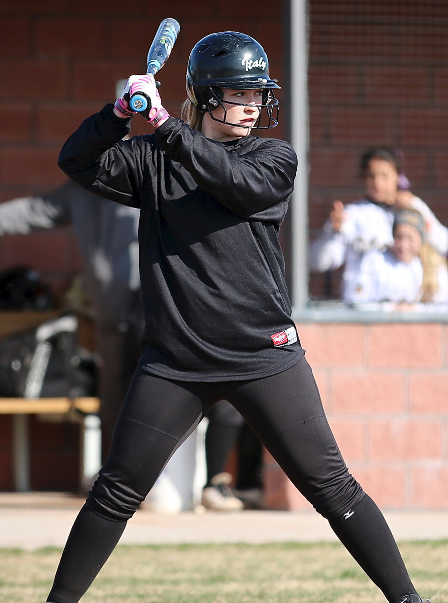 Image: Junior slugger Jaclynn Lewis prepares to pummel a Leon pitch.