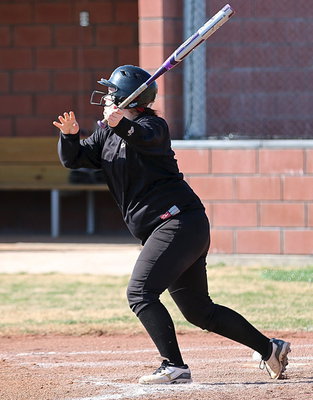 Image: Lone senior Paige Westbrook hits her way on base for the Lady Gladiators.