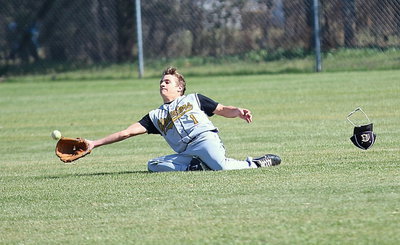 Image: Levi McBride(1) makes a spectacular diving catch in right field to inspire his teammates.
