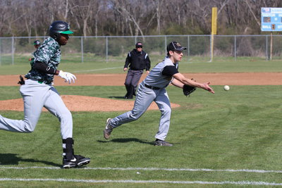 Image: Pitcher Ryan Connor(4) fields a grounder and then tosses the ball to first-base for an out against Kerens.