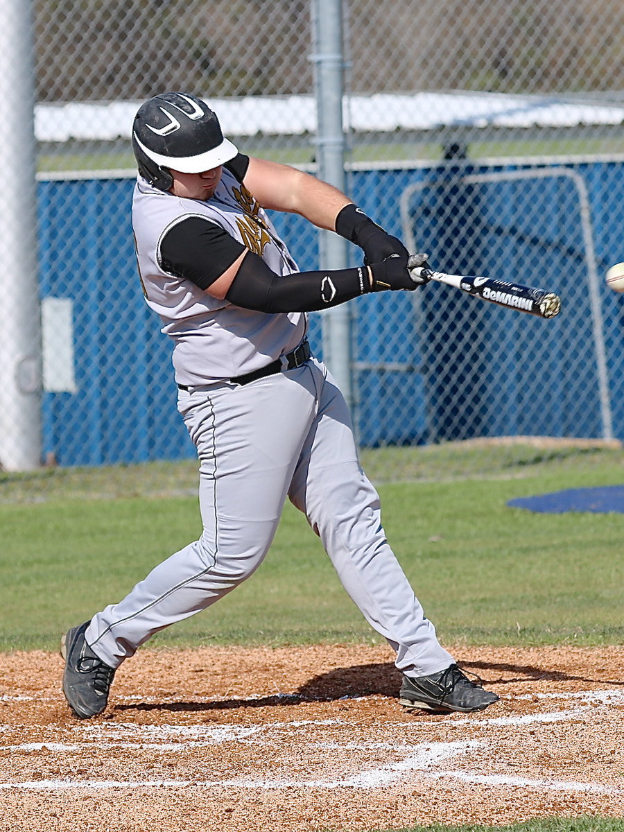 Image: Kevin “Big Agua” Roldan(16) swings away.