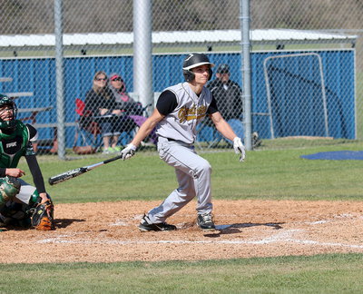 Image: Levi McBride(1) connects on a long ball to right field.
